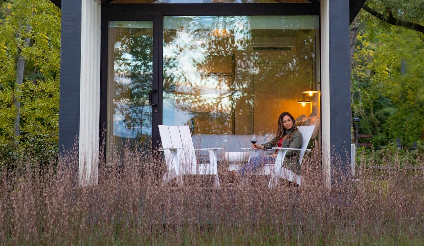 Woman drinking wine in a vacation rental in Ulster County, NY