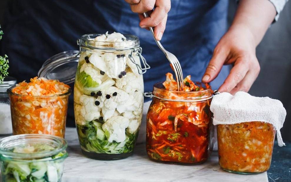 man fermenting a variety of vegetables