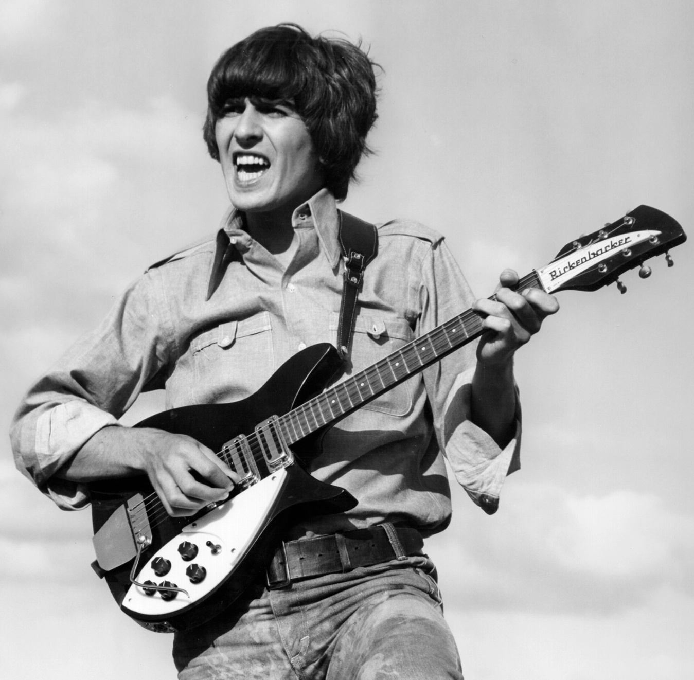 George Harrison playing the guitar