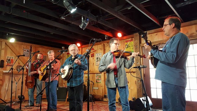 moonshine creek bluegrass band playing on stage